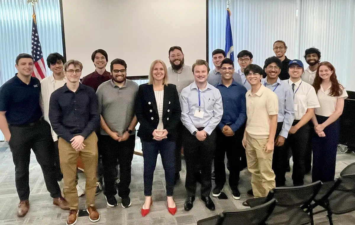 Seventeen SAIC employees and interns gather for a group photo.