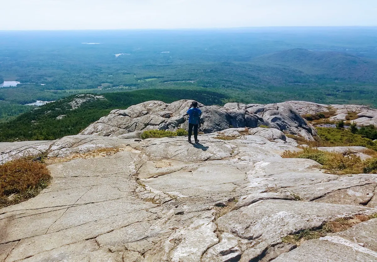 Lone Hiker on a Bare Mountain Top