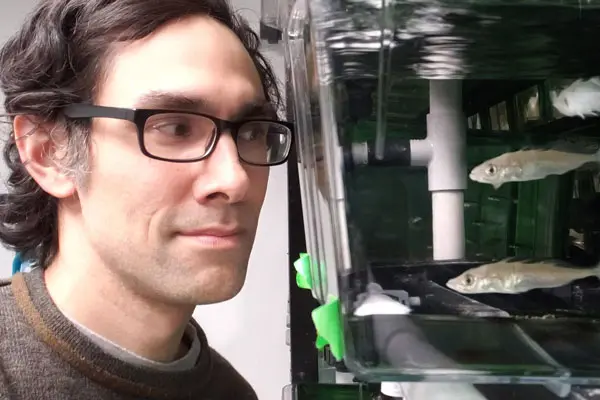 Frederic Chain looking at fish.