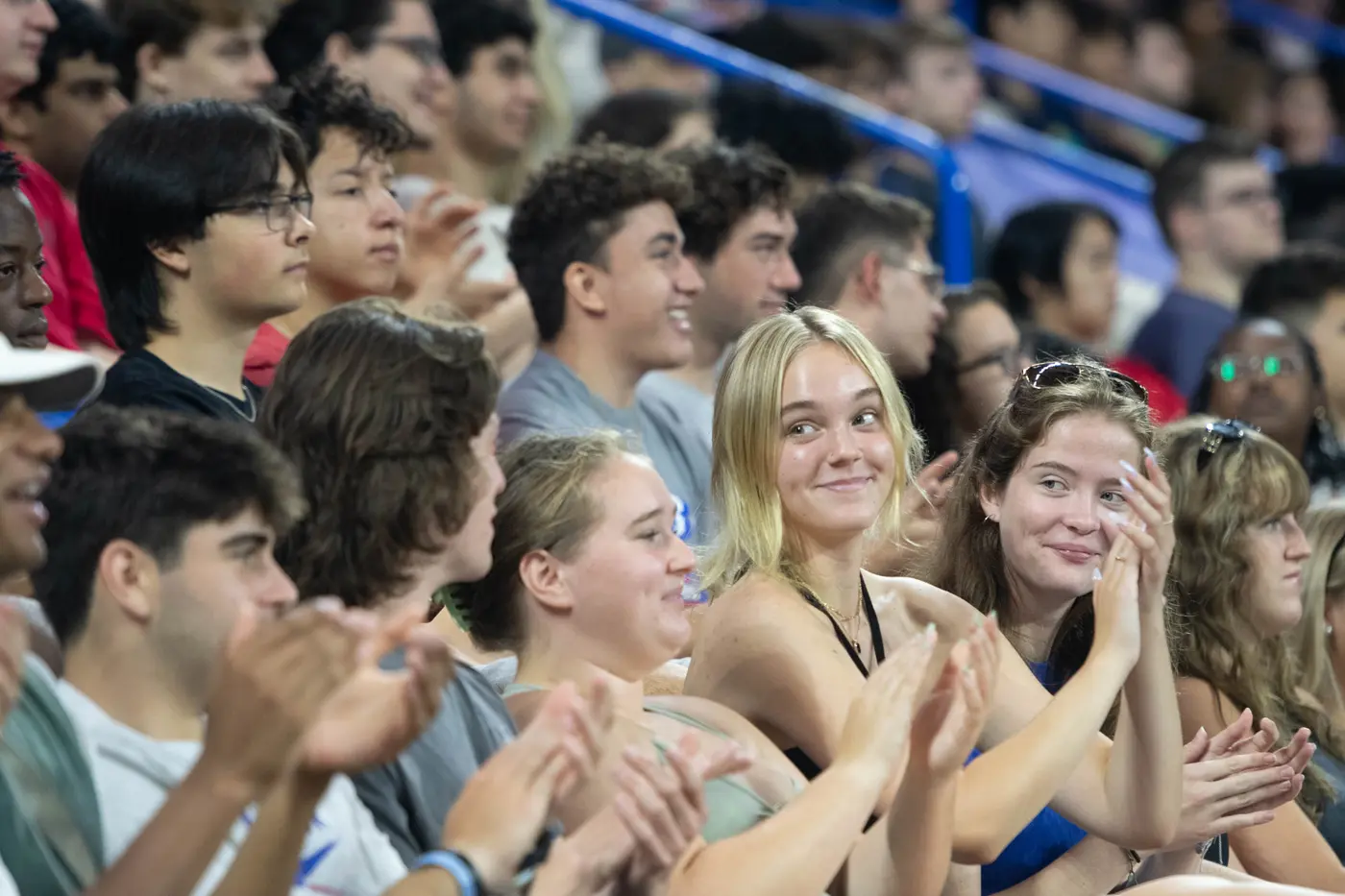 Student smiling and applauding