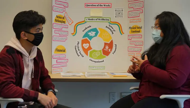 UMass Lowell student Angeline Castillo talks with another student.