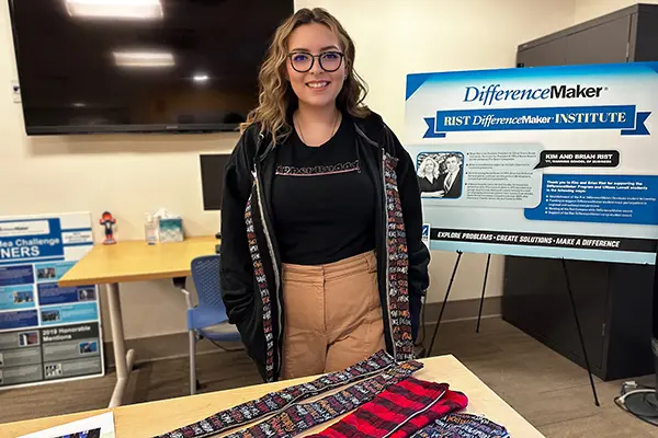 BLA major Sandi DeRuntz at the Rist DifferenceMaker Institute with several ZipperBuddy prototypes