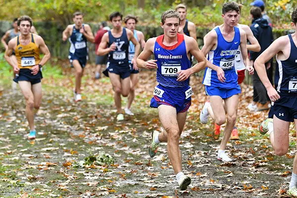 BLA graduate Jake Velazquez '24 running cross country at a meet 
