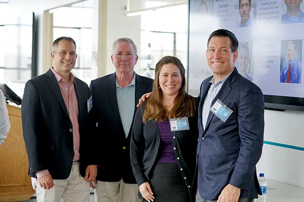 Denise Dunlap and Bill Yelle pose with panelists at M2D2