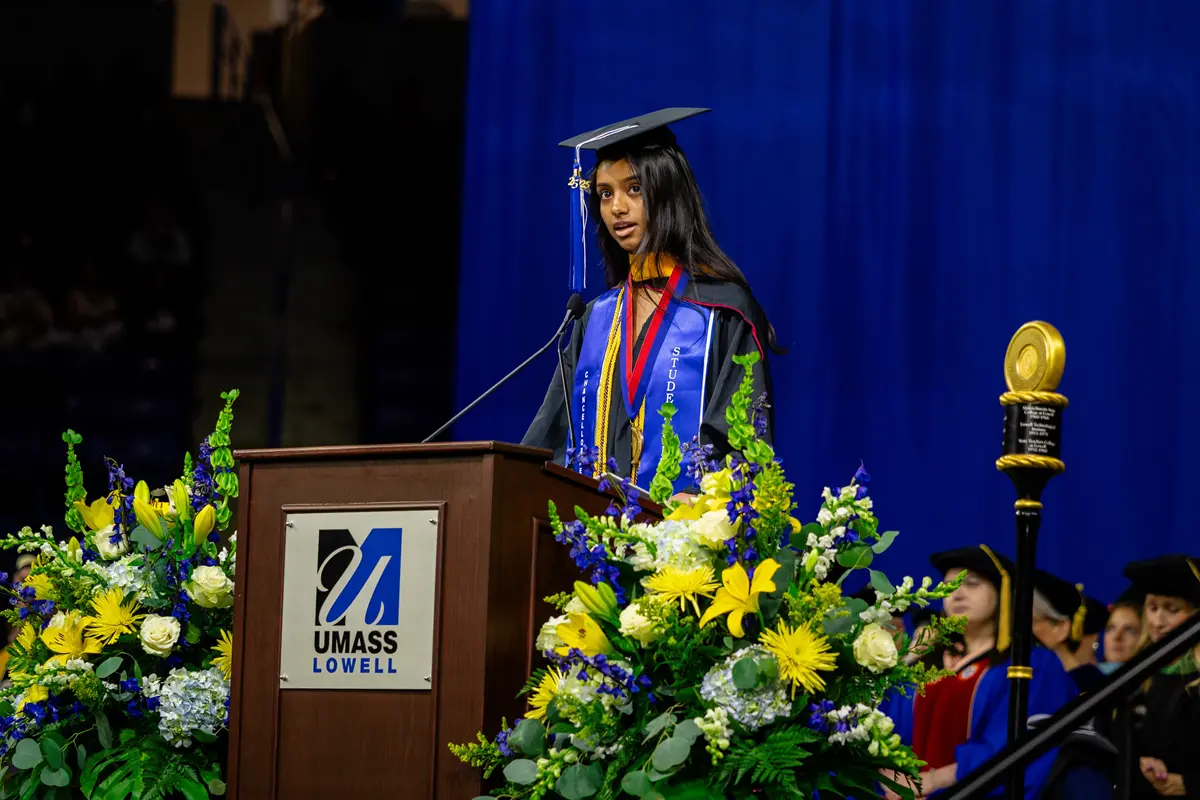Student commencement speaker Sameera Jangala speaks from a podium