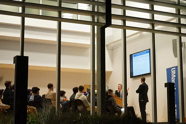 Bill Cox and Ethan Brown speak to a full room at ETIC