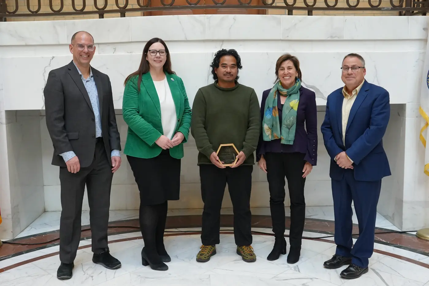 Five people at the Leading by Example awards ceremony.