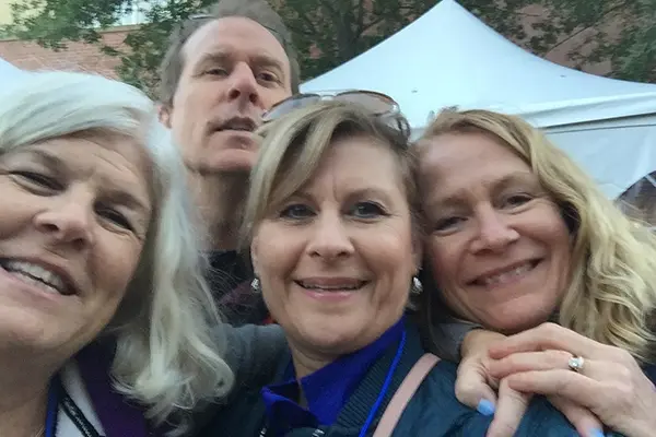 Deb Rosati '82 '90 with friends on Hawkey Way at UML Homecoming