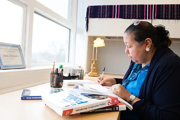 Assoc. Prof. Deina Abdelkader grading papers