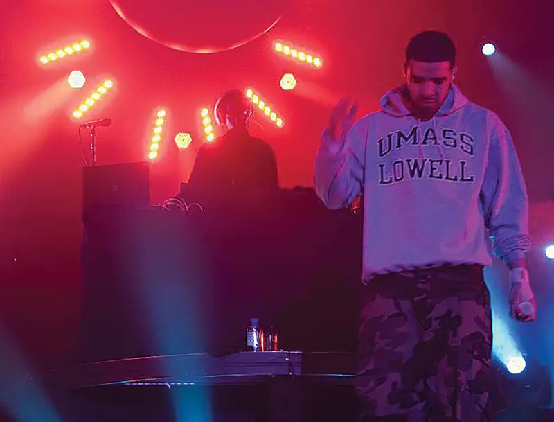 Drake wearing a UMass Lowell sweatshirt