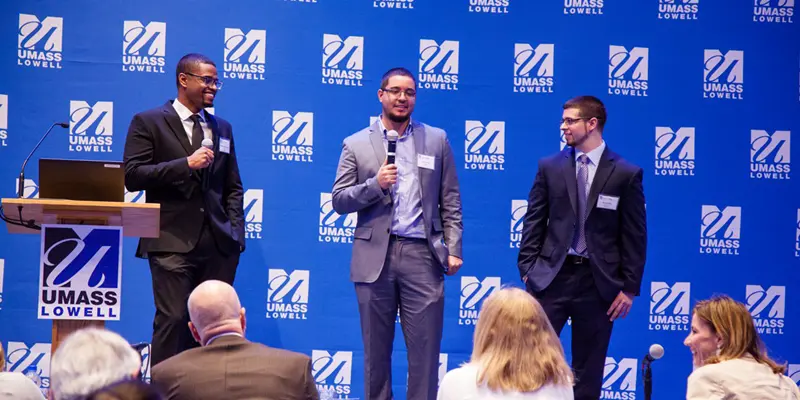 The ETRALock team onstage pitching to DifferenceMaker judges