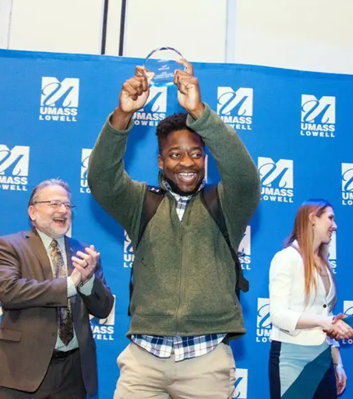 Student receiving award