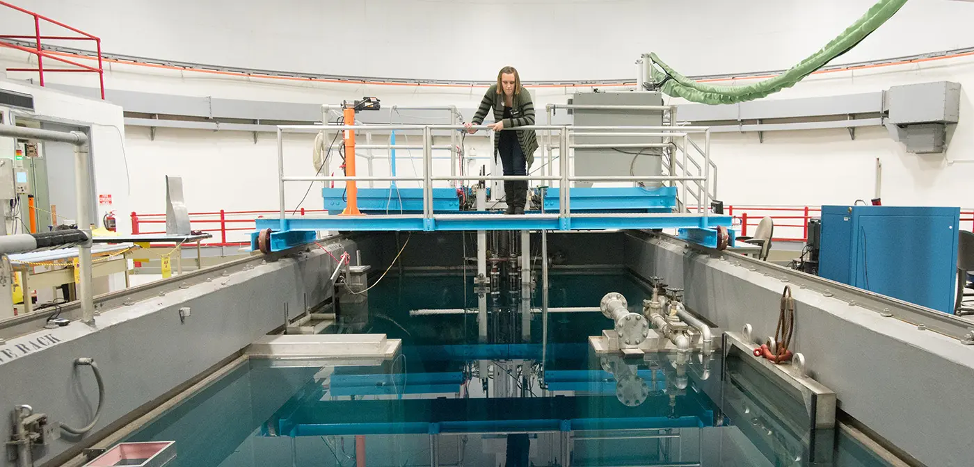 Chemical/Nuclear Engineering student working in reactor.