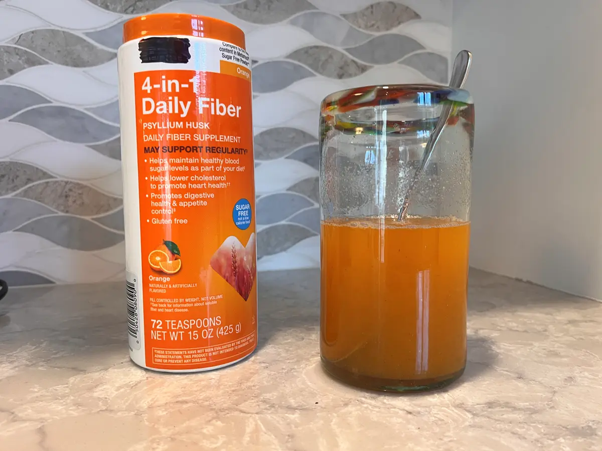 Fiber supplement and glass with psyllium husk diluted in water