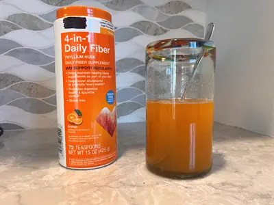Fiber supplement and glass with psyllium husk diluted in water