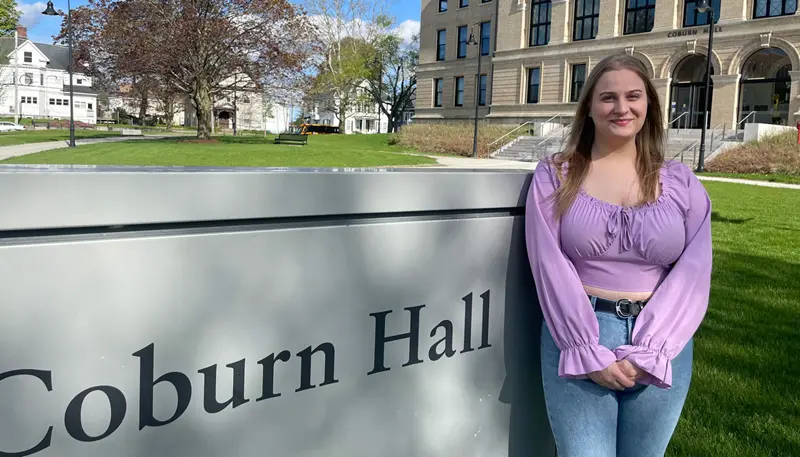 Gabrielle Salvatore standing in front of Coburn Hall.