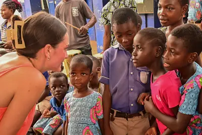 A doctor talks to a group of people at a hospital.
