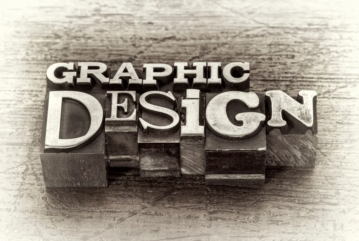 Graphic design word abstract in metal type on blocks.
