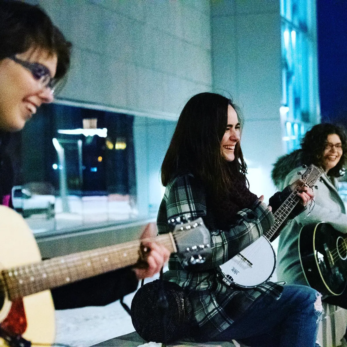 Students playing guitars