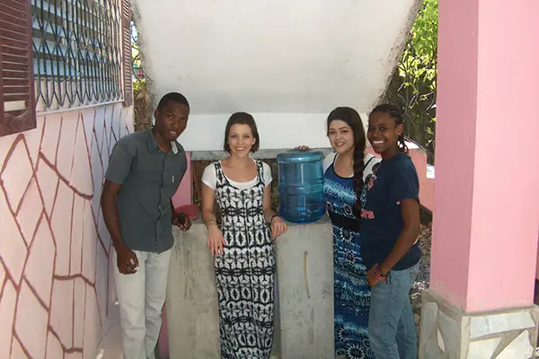 Ralph Douyon and Danaya Alabre with two visiting UML students and the BioBubbler.