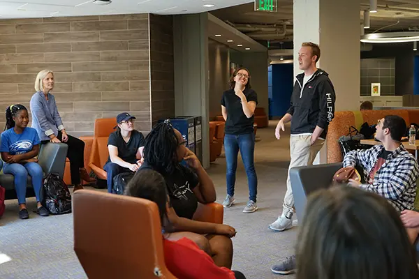 Sophomore UML Honors College students Jaime Tardanico and Carson Tully talk to Anne Apigian's students in the First-year Seminar in Honors