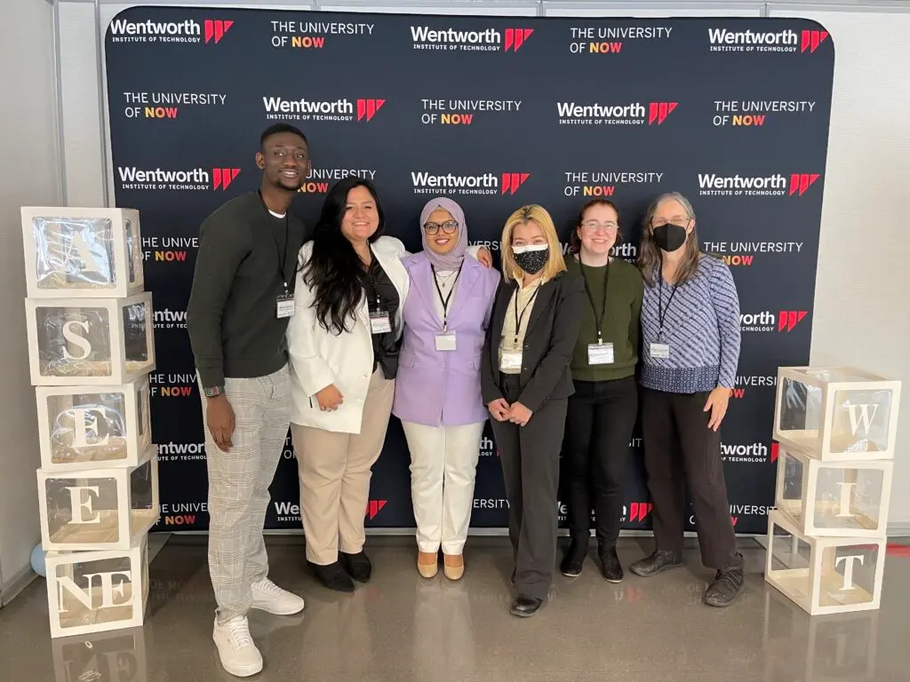 Group photo of 6 people in front of background for 2022 ASEE NE conference. 
