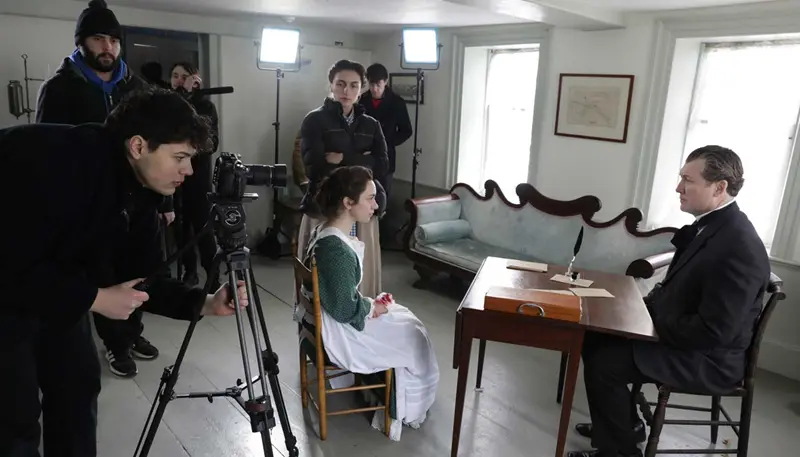 Jake Abramowitz filming actors on a movie set