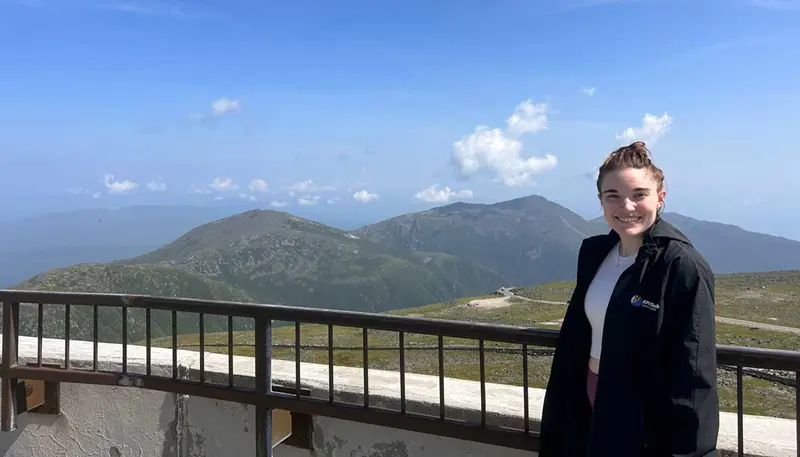 Jamie-Lyn Cavallon poses at the top of Mount Washington.