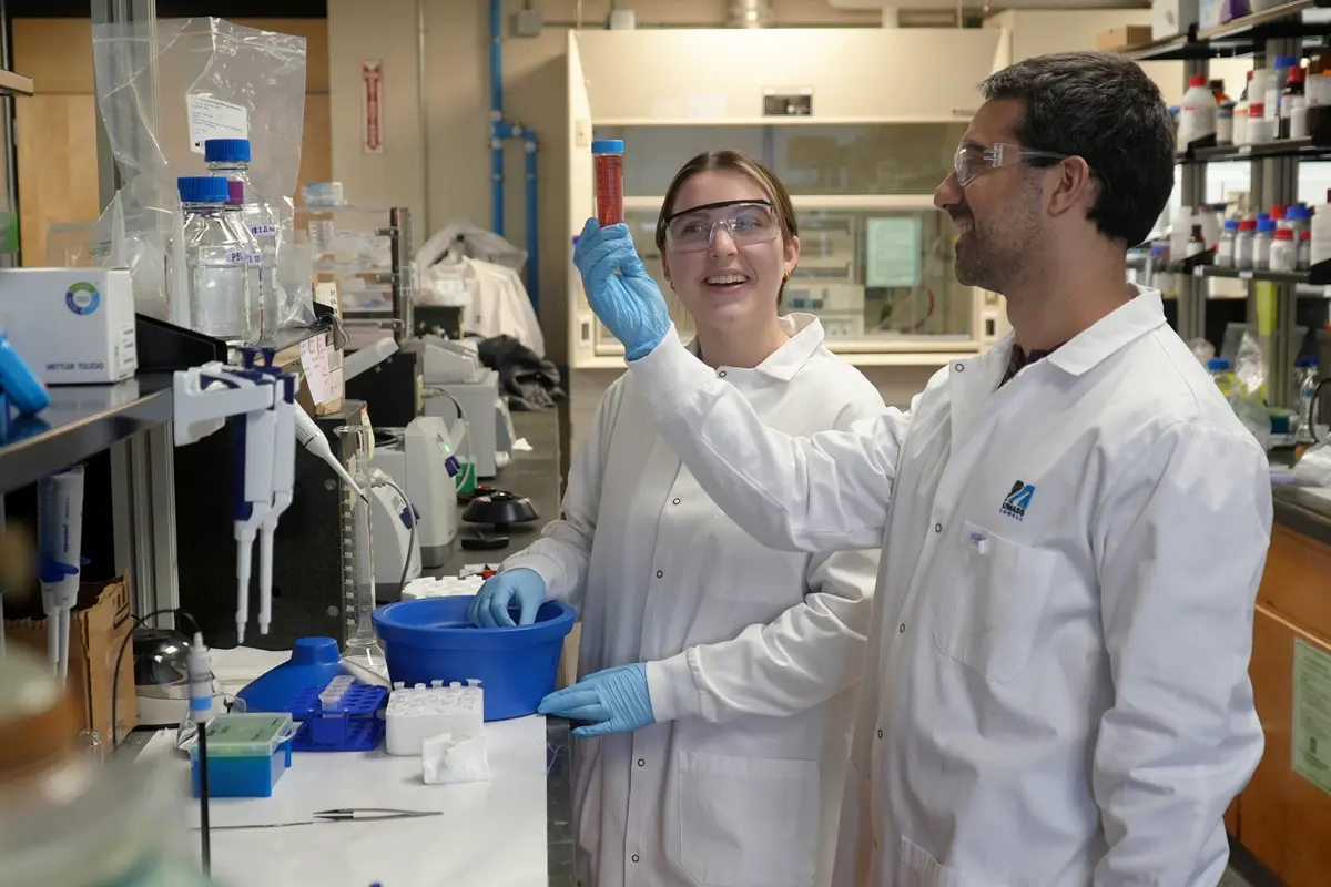 Julianne Gath and Michael Ross examine gold nanoparticles.