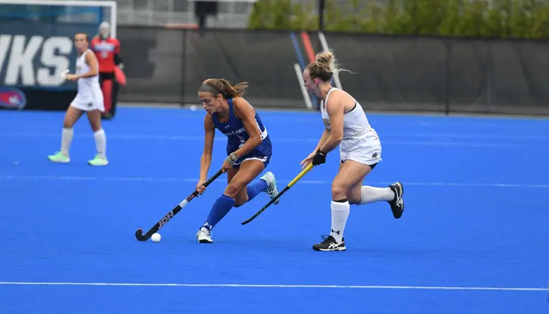 Megan Salsinha playing field hockey at UMass Lowell