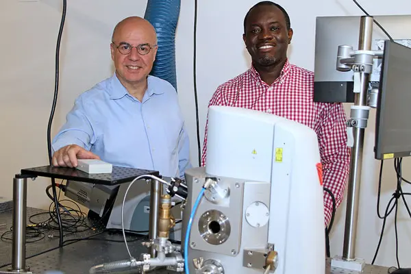 Dean Melikechi and his postdoc in the lab