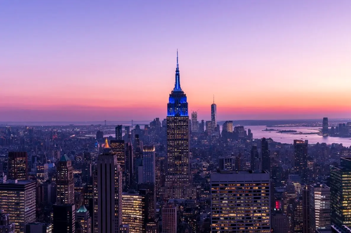 Twilight photos of New York City skyline with Empire State building in the center