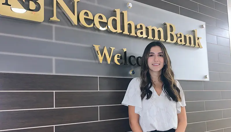 Nadine Chamoun in front of Needham Bank