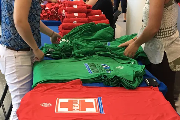 RAs at UMass Lowell get ready to distribute t-shirts on move-in day for the living-learning communities