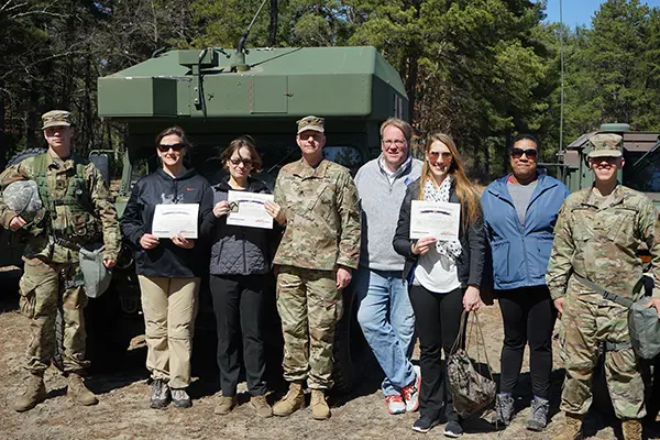 Manning faculty and students pose with cadets and Josh Goodrich
