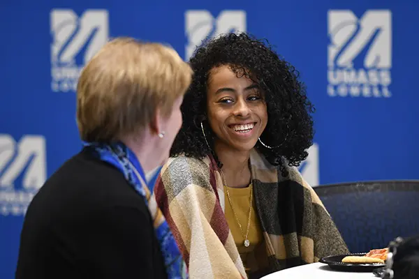 Student Lissette Robles talks with Joanne Yestramski at the lunch