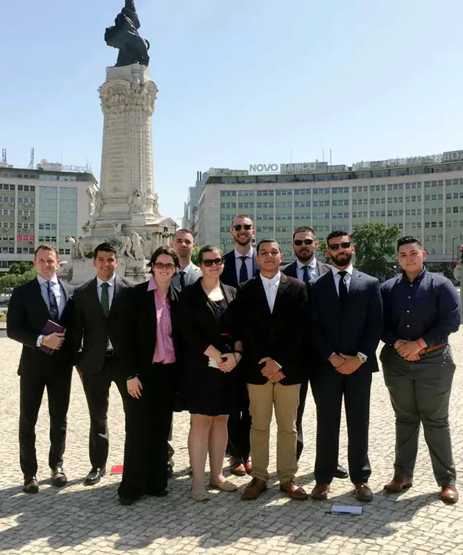 A group of students standing with Neil Shortland outside of the Department of Homeland Security’s P2P: Challenging Extremism competition.