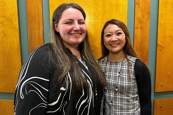 UML psychology major Kiley McNeil with Bopha Malone, executive director of Girls Inc. of Greater Lowell