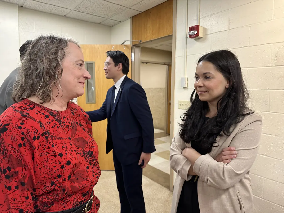 Honors College Dean Jenifer Whitten-Woodring and Zayna Basma-Doyle stand and talk