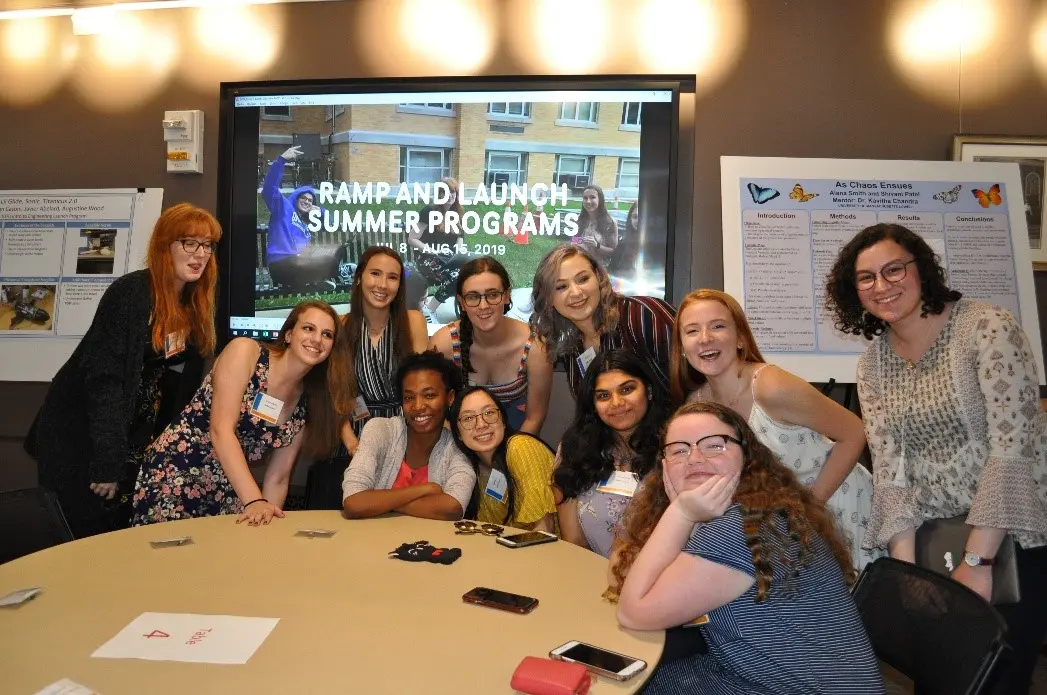 Members of the RAMP program around a table