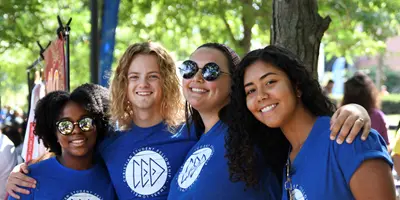 Group of four students at student club fair