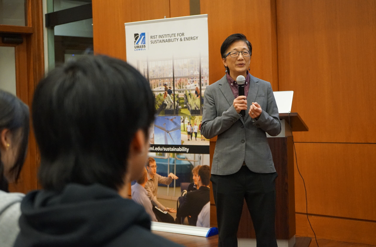 Chancellor Julie Chen speaking with a Rist Institute for Sustainability & Energy banner behind her.