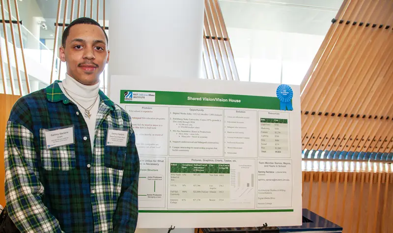 Team Shared Vision/Vision House smiling with their DifferenceMaker idea poster.