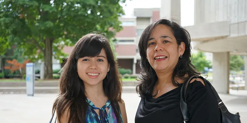 Sofia Savoca with her mom outside O'Leary Library on South Campus