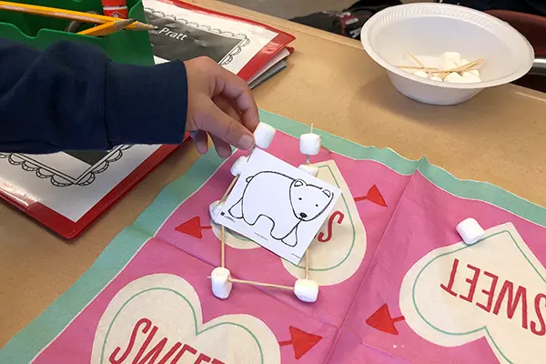 A student does a craft