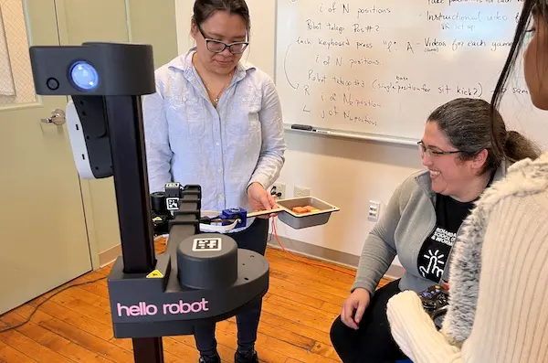 ThienTran Le and Maru Cabrera test the robot