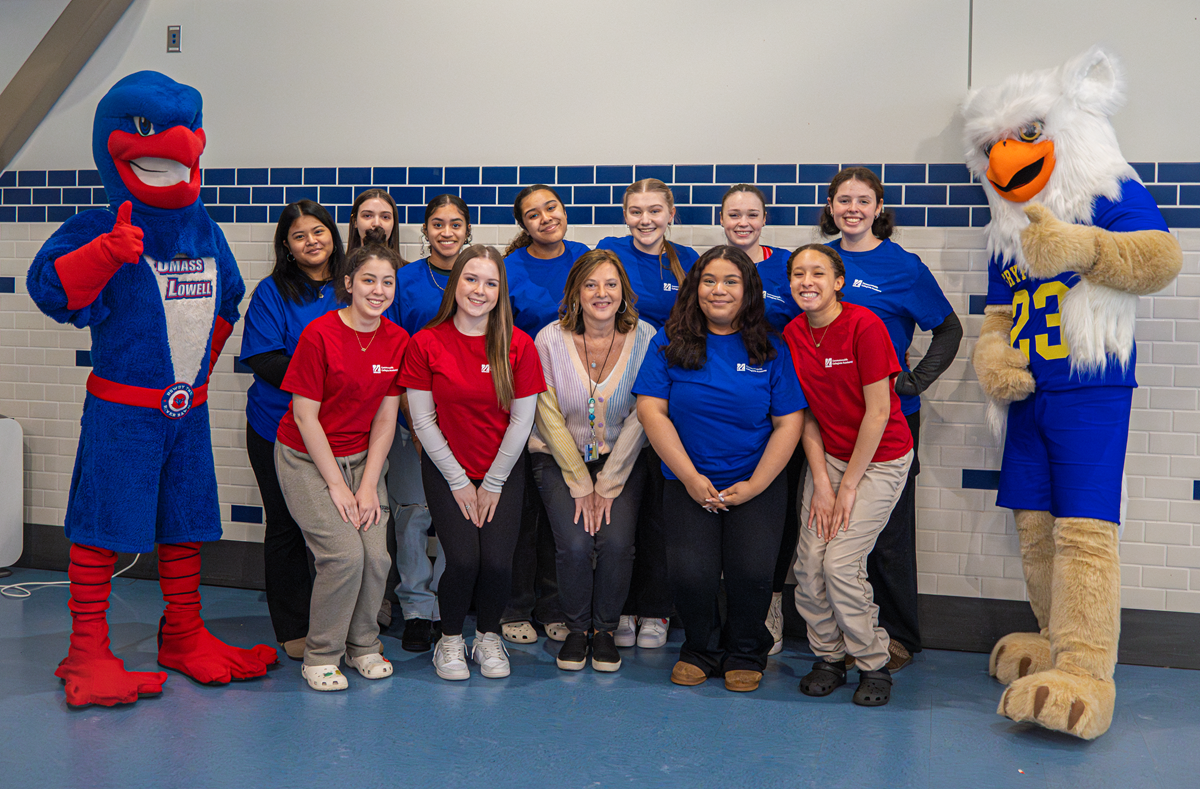 Early College students pose with UMass Lowell and Greater Lowell Technical High School mascots.