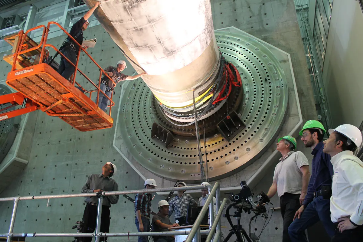 Workers inside a wind turbine.
