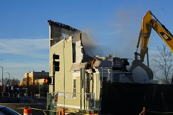 A vacant building is demolished on East Campus
