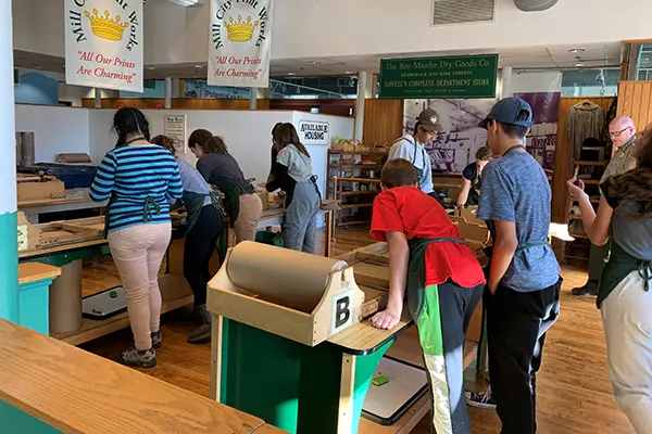 Students work on an assembly line at the Tsongas Industrial History Center